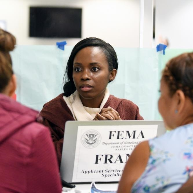 image of a young Black woman at a FEMA disaster recovery center