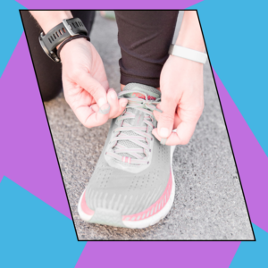 A woman tying a running shoe